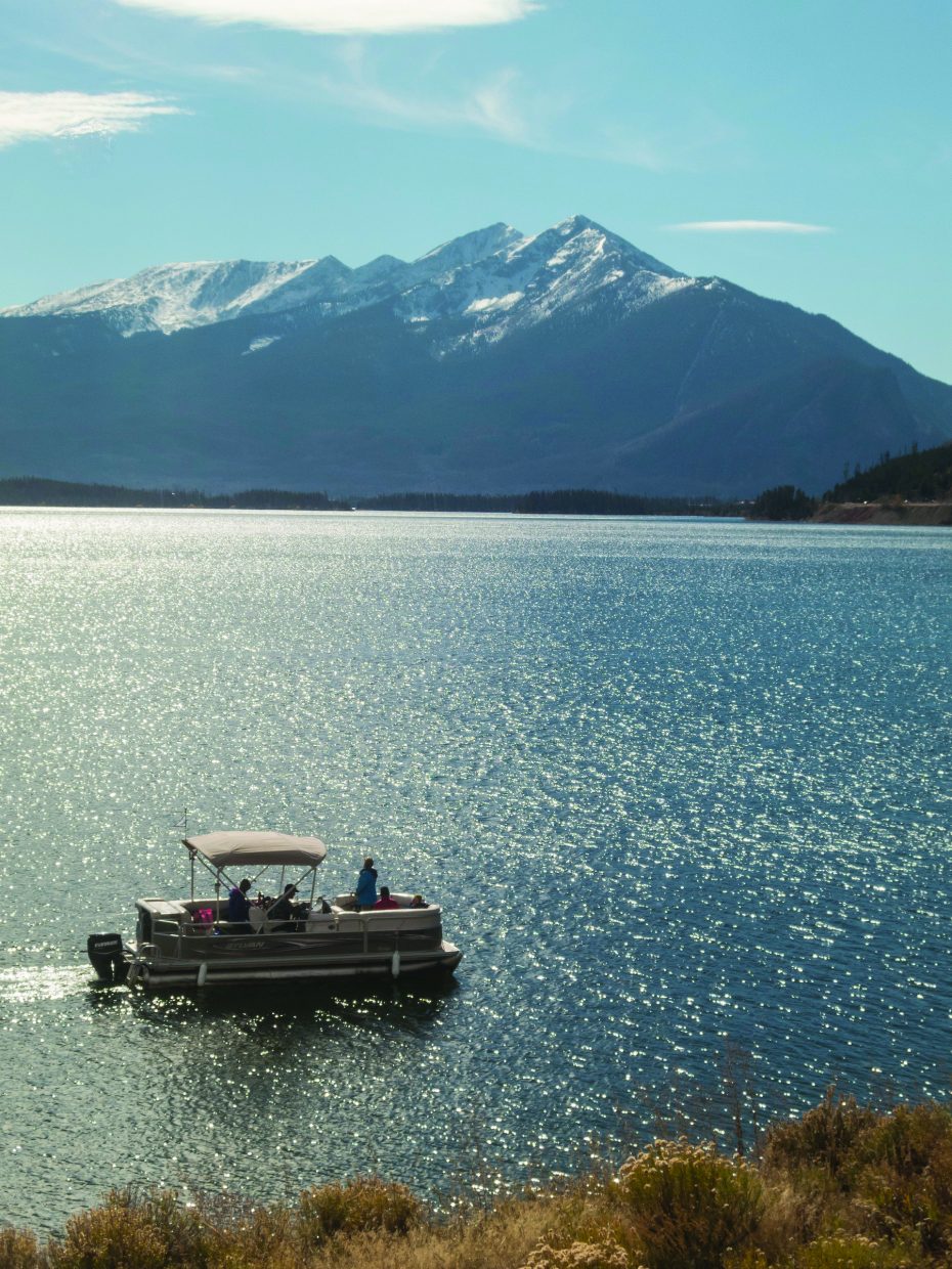 Pontoon boat on Lake Dillon with mountains