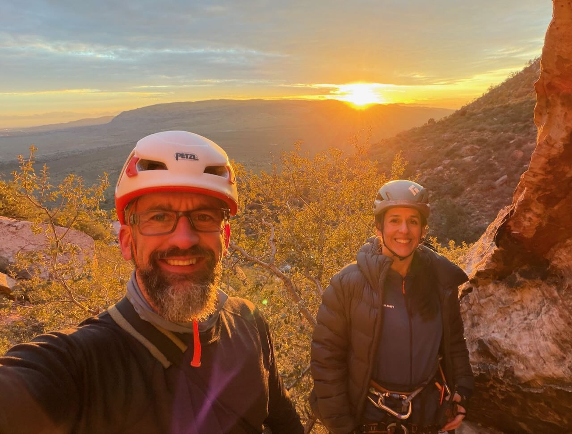 Justin and Alli climbing at sunset