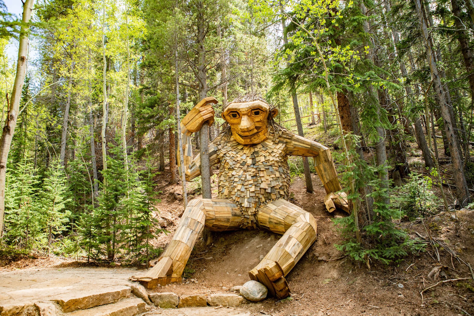 The Breckenridge Troll wooden sculpture in the forest